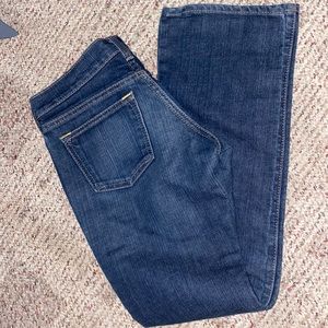dark blue low rise boot cut jeans by “the diva”